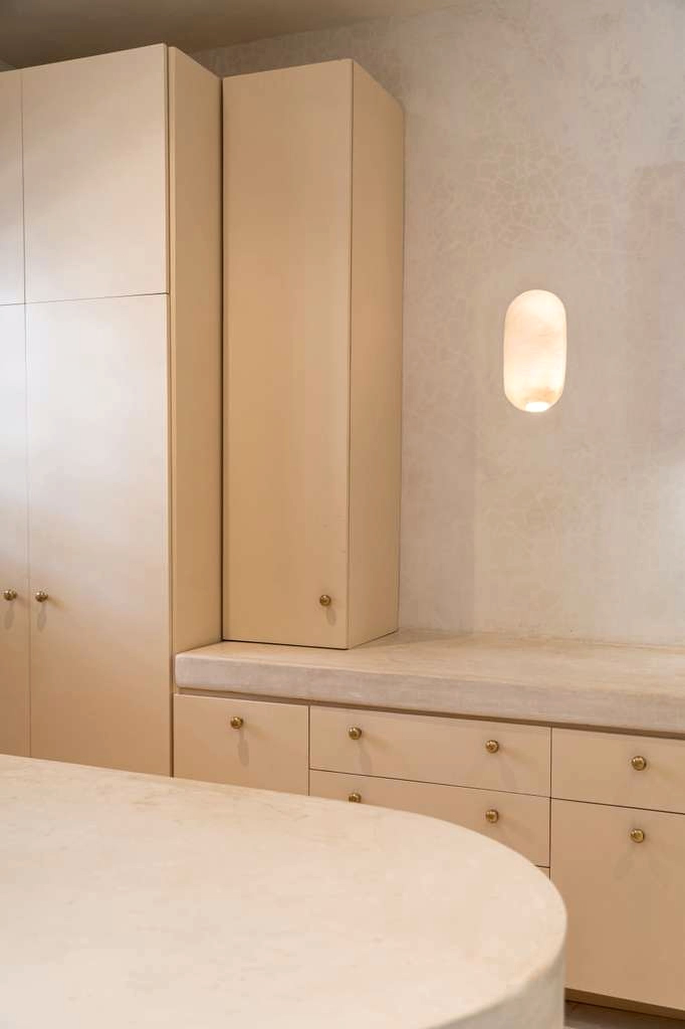 Dressing area with brass and alabaster detail at a private luxury retreat, Akumal, Mexico