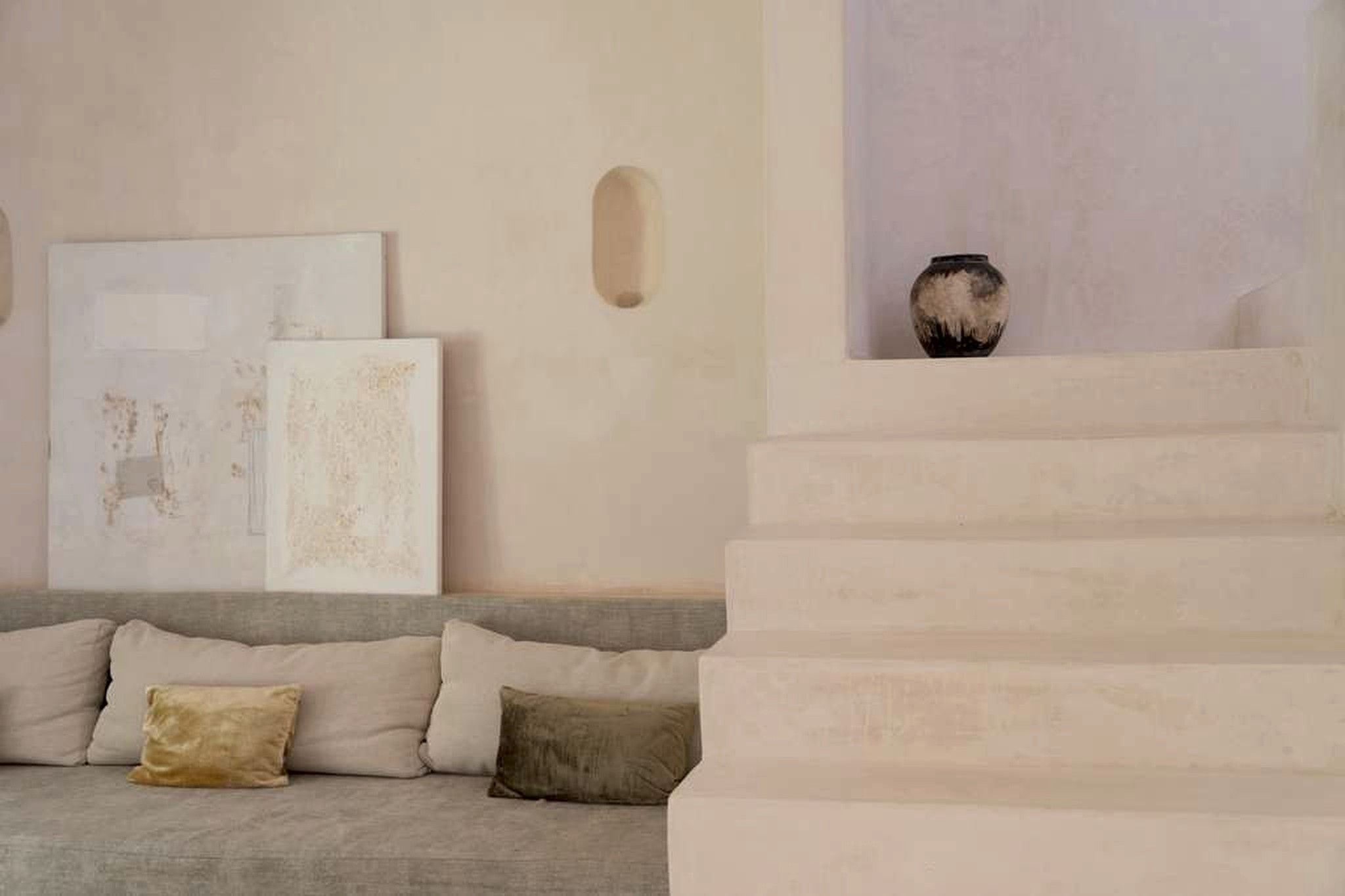 Private living area at 1111%, a luxury wellness retreat in Akumal near Tulum, Mexico — hand-troweled plaster walls and sculptural design