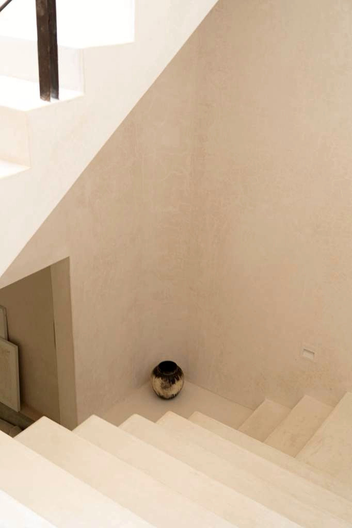 Sculptural plaster stairwell at a private wellness retreat near Tulum, Mexico